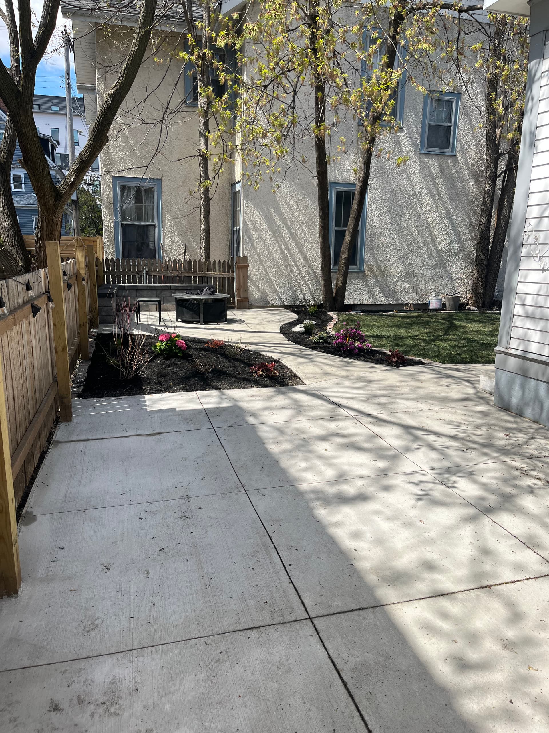 Minneapolis Backyard Gets a Concrete Patio, Sod, and Plant Beds