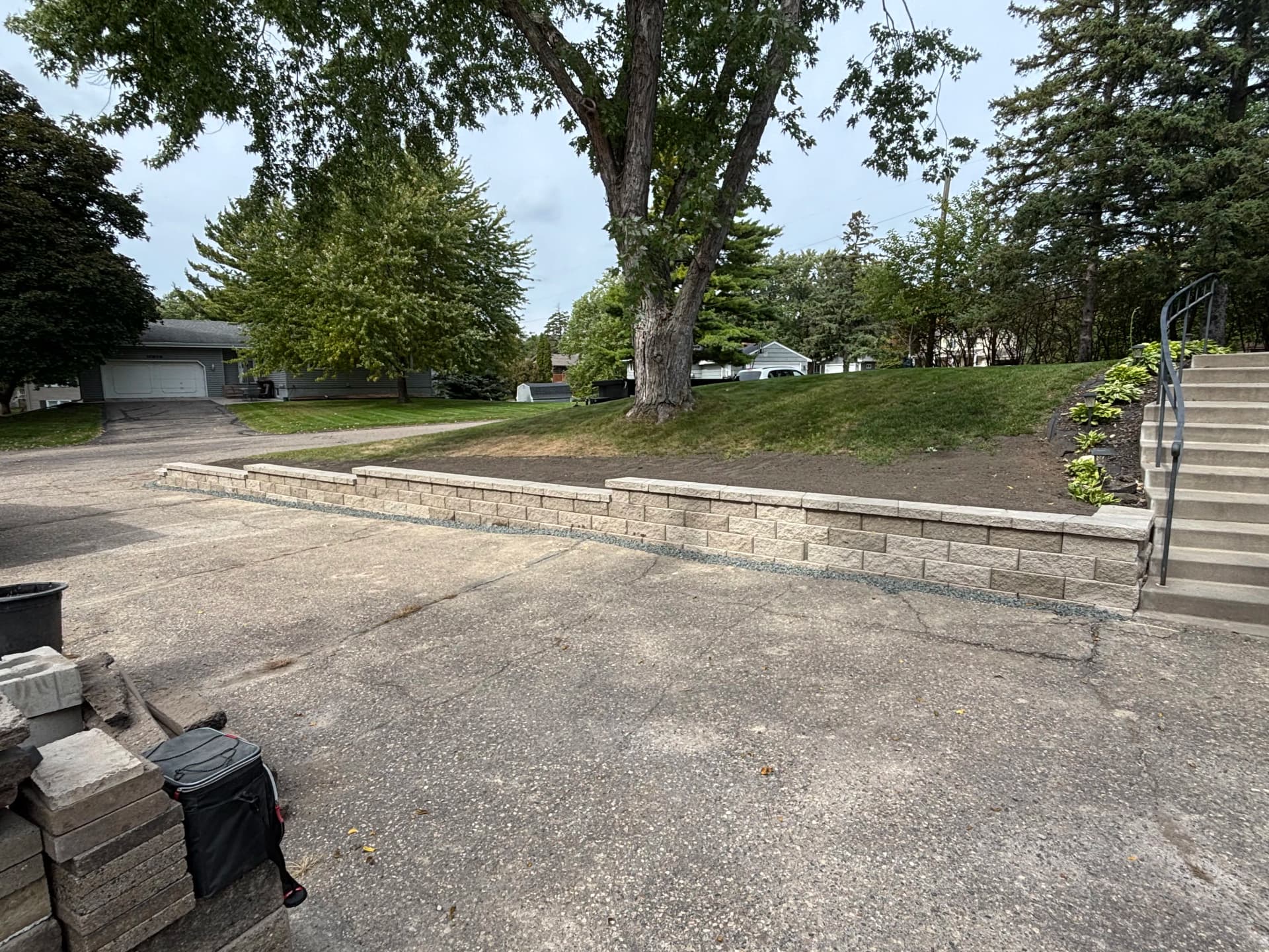 Porcelain Paver Patio, Fire Pit and Retaining Walls in Hopkins