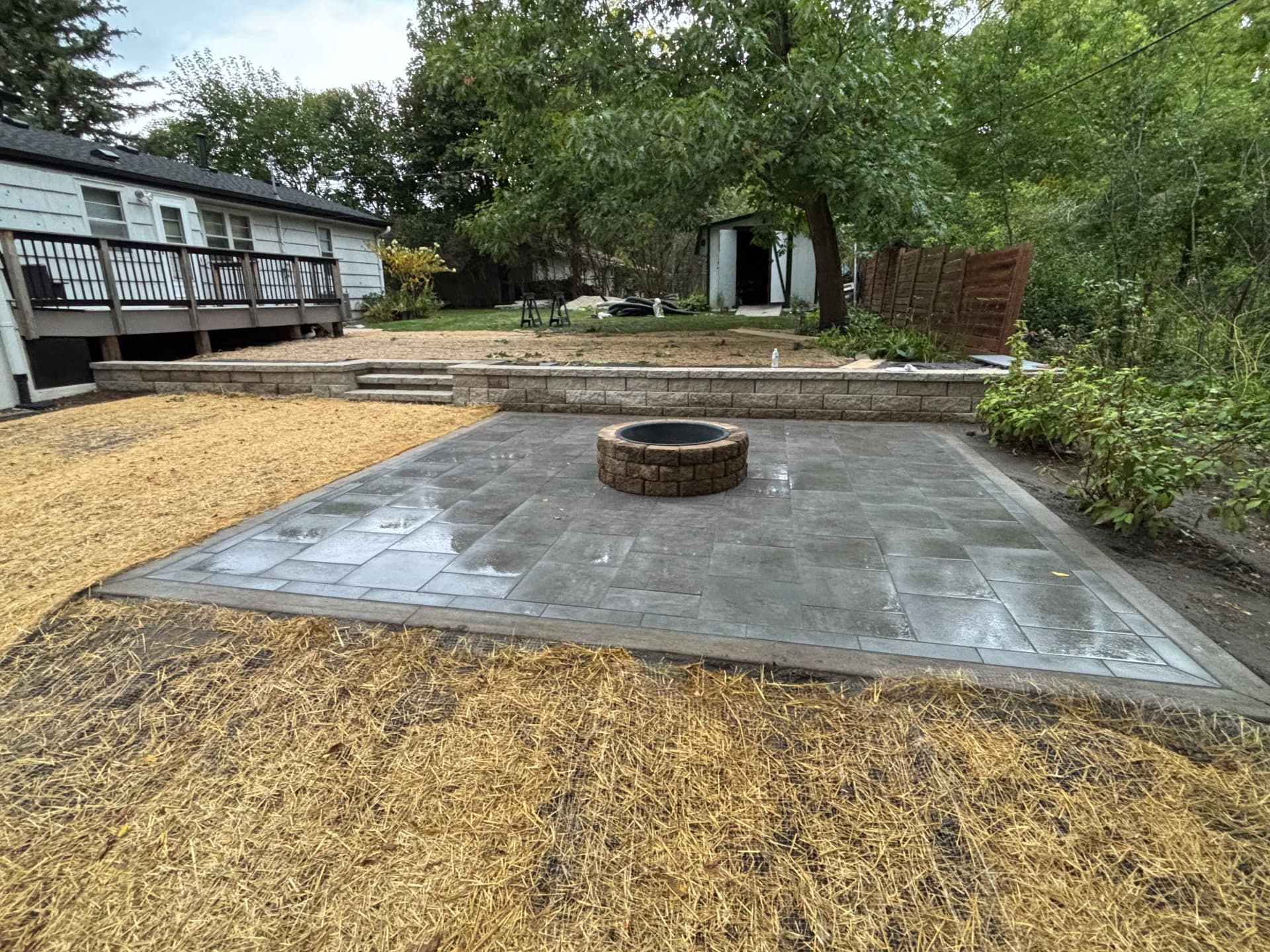 Porcelain Paver Patio, Fire Pit and Retaining Walls in Hopkins