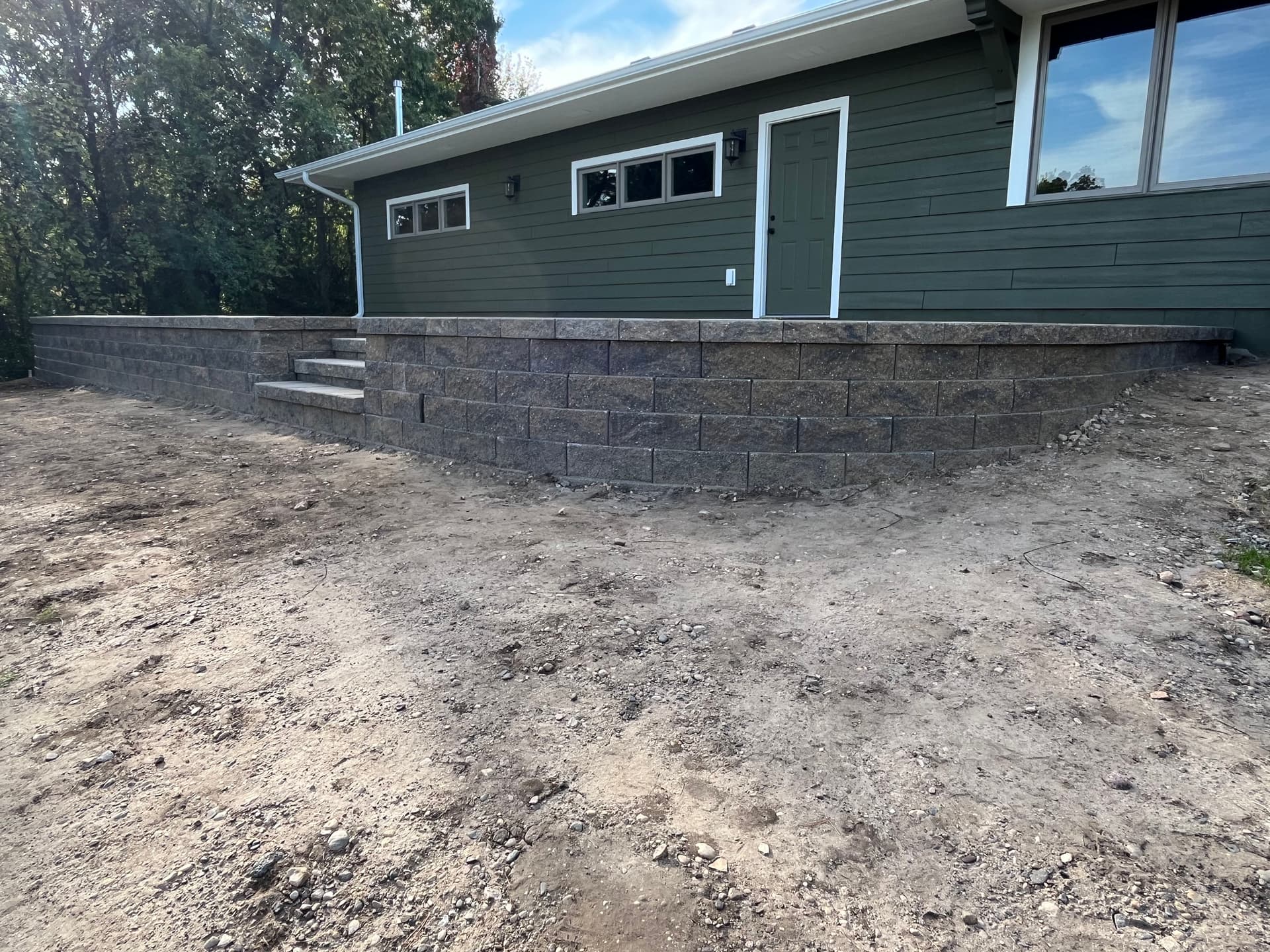 Steep Slope Turned Usable Space with a Retaining Wall in Bloomington