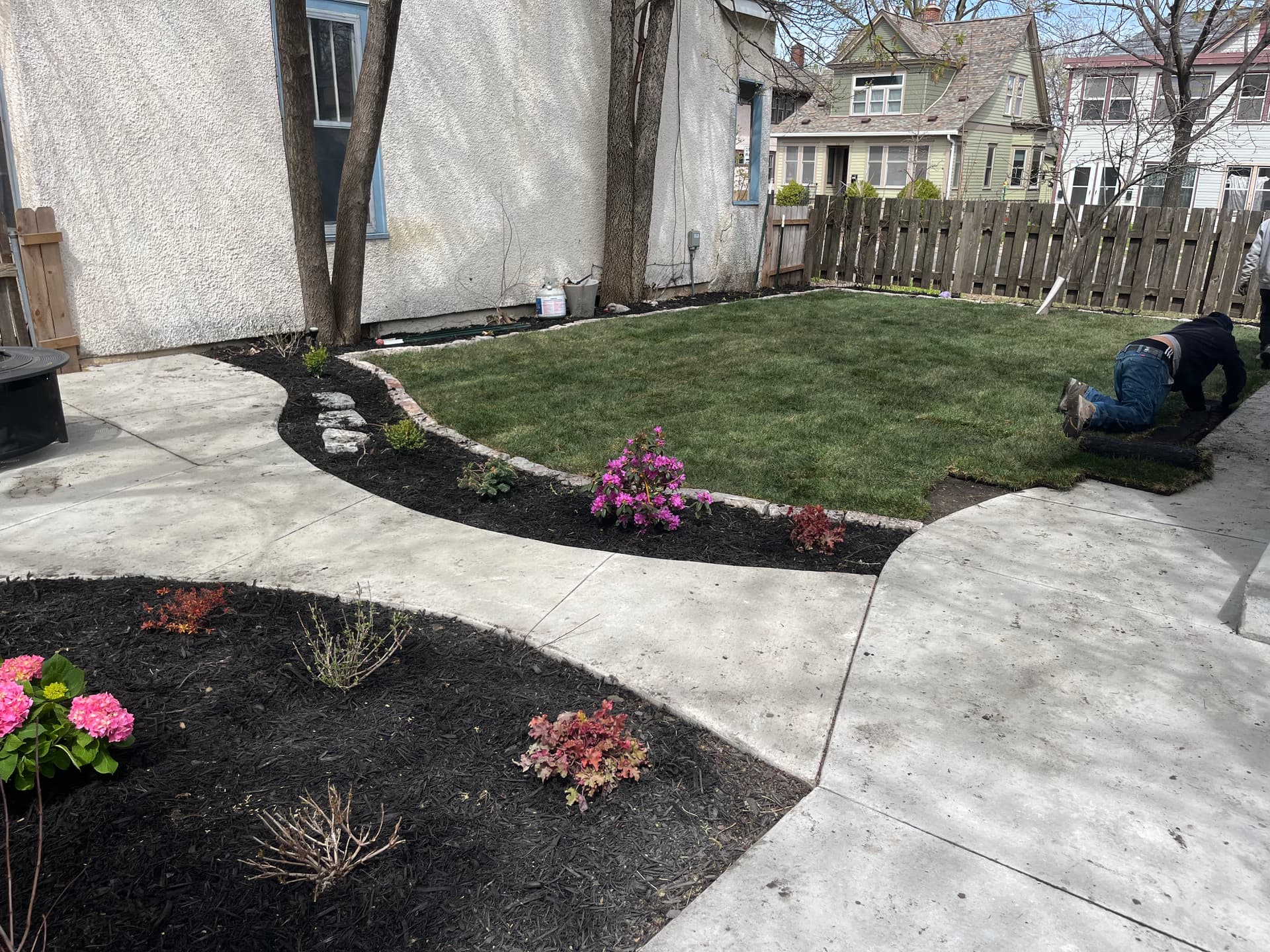 Minneapolis Backyard Gets a Concrete Patio, Sod, and Plant Beds